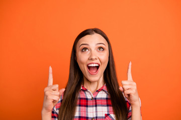 Close-up portrait of her she nice attractive crazy cheerful cheery straight-haired girl pointing two forefingers looking up black friday isolated on bright vivid shine vibrant orange color background