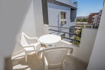 Terrace balcony with chairs in tropical luxury apartment
