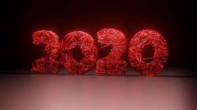 2020 New Year golden numbers braided from wire. Creative concept for the holiday. Light effects.