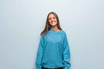 Young pretty woman wearing a blue sweater cheerful with a big smile