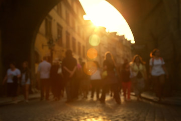 blurred background. a lot of people walking on a city street.