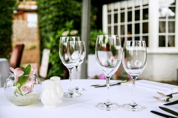 Wine glasses on a  patio table at a restaurant