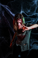 portrait of horrible zombie woman with wounds. Horror. Halloween make-up and costume