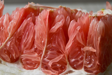 Red pomelo. A close-up macro shot.