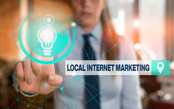 Text sign showing Local Internet Marketing. Business photo showcasing use Search Engines for Reviews and Business List Female human wear formal work suit presenting presentation use smart device