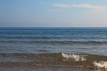 Mediterranean blue sea and boats on the horizon