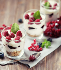 Natural yogurt with fresh berries and muesli. Healthy dessert.