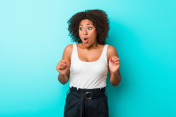 Young african american woman being shocked because of something she has seen.