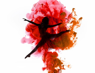 silhouette of ballerina dancing in colorful pink and red smoke splashes isolated on white
