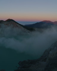 First light with fog. Sunrise on on the mountain  Ijen  Java ,Indonesia.