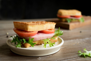 waffle sandwich with ham and tomato