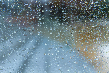Fototapeta na wymiar Raindrops on a window glass