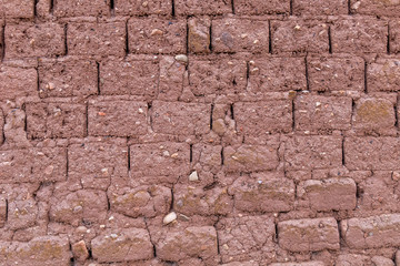 Brick wall from dry brown dirt stone typical for south America