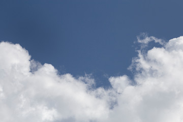 White fluffy clouds in the blue sky