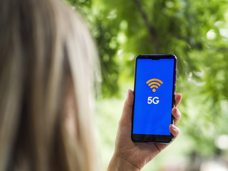 Woman holding phone close-up