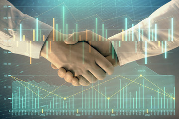 Multi exposure of forex graph on abstract background with two businessmen handshake. Concept of success on stock market