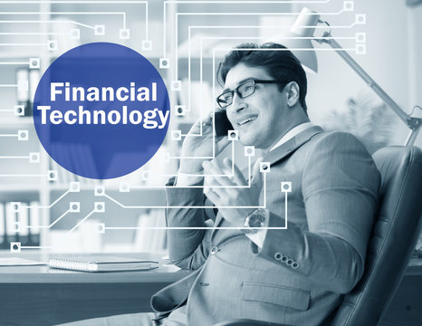 Businessman talking on smartphone in fintech concept