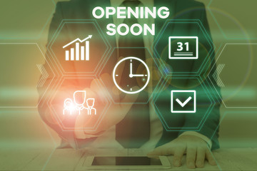 Text sign showing Opening Soon. Business photo text an act or instance of making or becoming open to the public Male human wear formal work suit presenting presentation using smart device