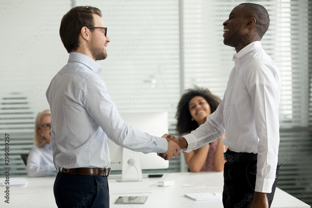 Sticker Happy diverse businessmen greeting each other with handshake