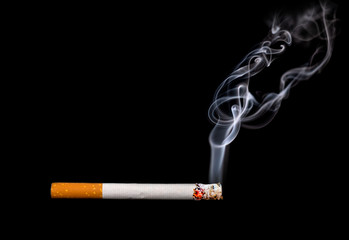 Close up of a cigarette with smoke showing