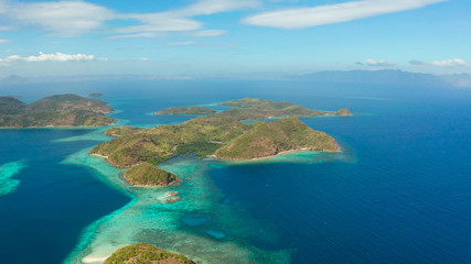 aerial seascape Lagoons with blue, azure water in middle of small islands. Palawan, Philippines. tropical islands with blue lagoons, coral reef. Islands of the Malayan archipelago with turquoise