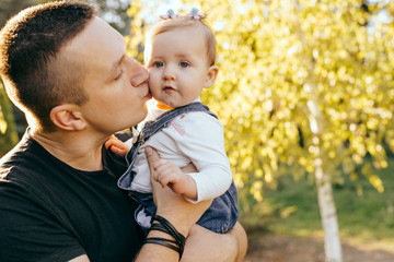 Fototapeta premium Happy younfather and her child enjoy the sunset outdoor - Image