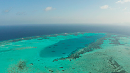 Fototapeta na wymiar Tropical islands and coral atolls with blue water of the sea, aerial view. Balabac, Palawan, Philippines. Summer and travel vacation concept.