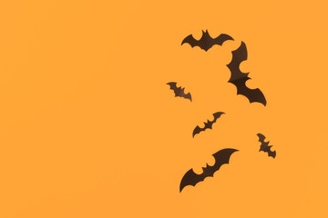 Halloween paper decorations on orange background. Halloween concept. Flat lay, top view, copy space - Image