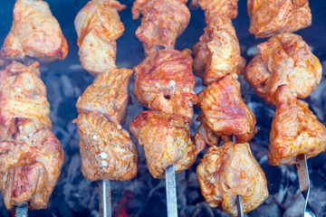 grilled meat over charcoal skewers