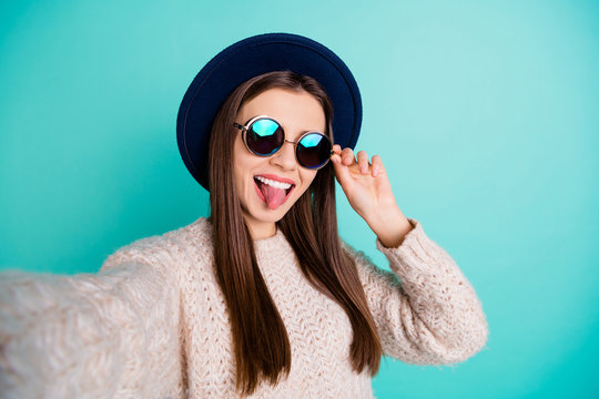 Close up photo of cheerful retro blooger take selfie on her vacation grimace wear knitted sweater isolated over teal turquoise background