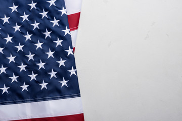 Flag of United States of America on stucco table top view