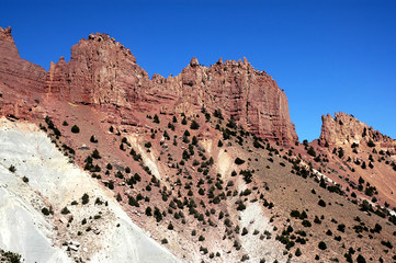 Mountain scenery between Herat and Qala-e-Naw, Herat Province in Afghanistan. These red craggy mountains are in a very remote part of western Afghanistan. On the road from Herat to Bala Morgab.