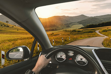 A man rides on a mountain road serpentine. Beautiful road between the hills. Summer landscape....