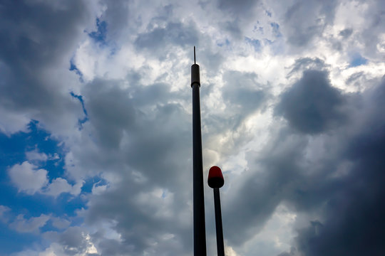 Lightning rod pointing to the cloudy sky