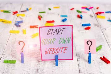 Handwriting text writing Start Your Own Website. Conceptual photo serve as Extension of a Business Card a Personal Site Scribbled and crumbling sheet with paper clips placed on the wooden table