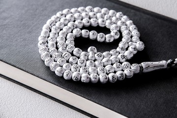 Prayer beads on Koran holy book of Muslims