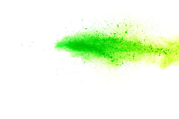 Green powder explosion on white background.