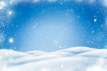 Winter Christmas landscape with snow, snowdrifts and snowfall. Blue background with copy space for your text.
