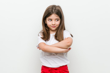 Fototapeta premium Little caucasian girl smiling confident with crossed arms.