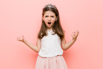 Little girl wearing a princess look screaming with rage. © Asier