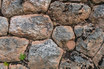 Natural stone abstract background wall made by ancient Inca of Peru in South America. Background with copy space