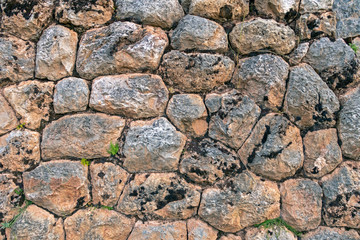 Natural stone abstract background wall made by ancient Inca of Peru in South America. Background with copy space