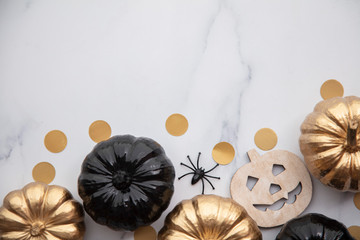 Halloween luxury gold and black pumpkin flat lay background composition