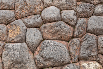 Natural stone abstract background wall made by ancient Inca of Peru in South America. Background with copy space