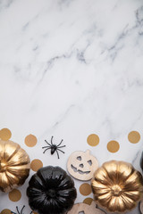 Halloween luxury gold and black pumpkin flat lay background composition