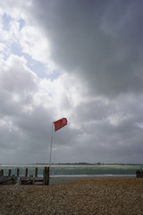 Red warning flag on a beach