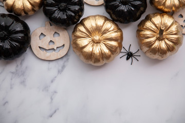 Halloween luxury gold and black pumpkin flat lay background composition