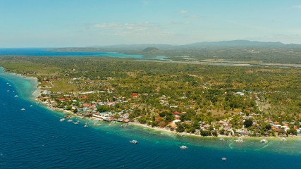 Fototapeta premium Coastline with coral reef and blue water, diving site, Moalboal, Philippines. Aerial view, Summer and travel vacation concept.