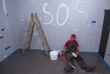 Tired construction worker, renovation