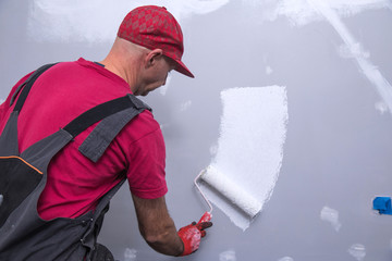 painter man at work with a roller